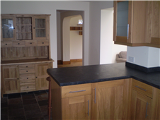  Shaker style oak kitchen with slate tile floor