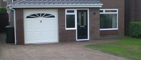 Porch and garage extensions with driveway